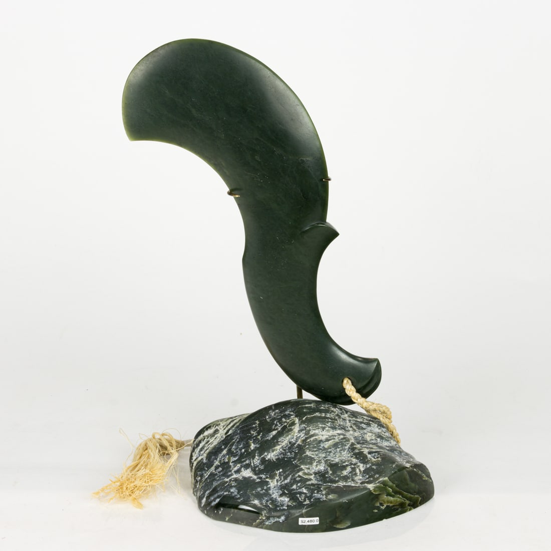 A Maori green stone Patu club on stand by Lewis Gardner: A Maori green stone Patu club on stand by Lewis Gardner, indistinctly signed on base, 11.5"h (club); 14.5" (overall)