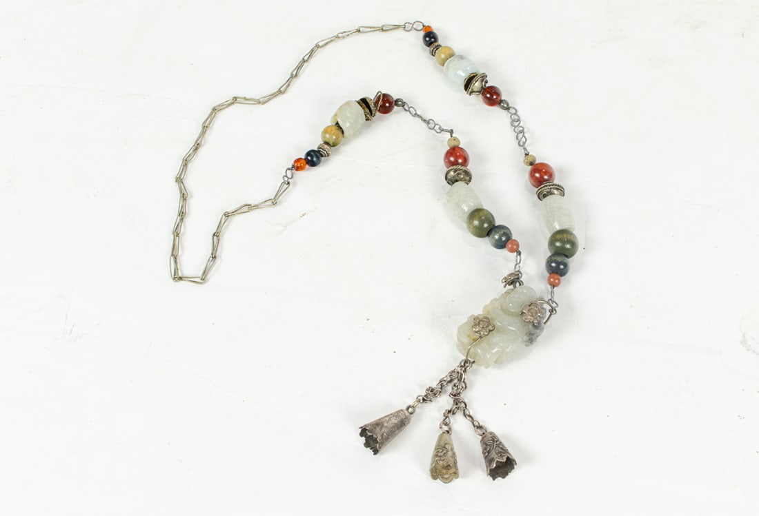 A Chinese white jade figural pendant (1 of 3)