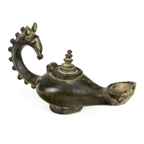 A Roman bronze oil lamp