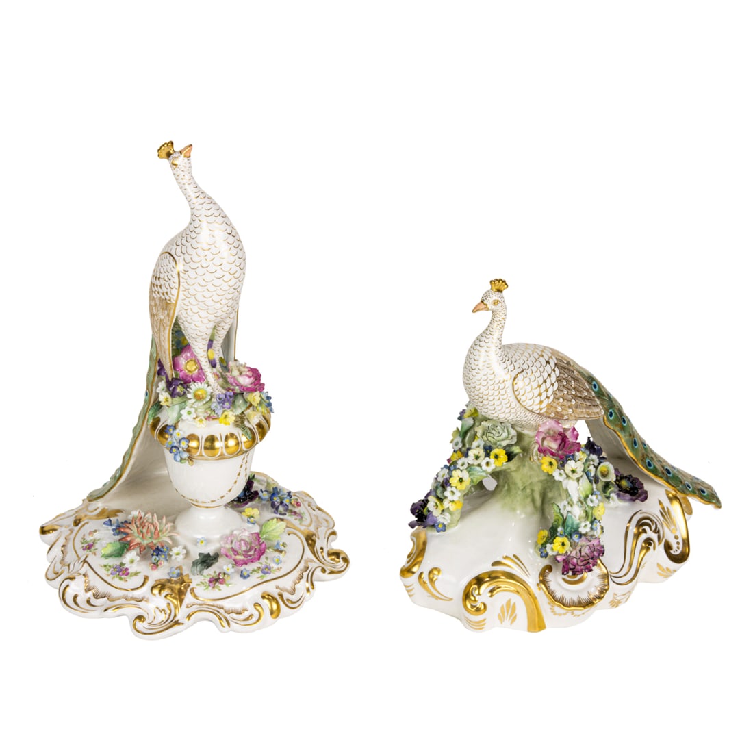 A pair of Royal Crown Derby porcelain peacocks: A pair of Royal Crown Derby porcelain peacocks, each embellished with applied flowers and gilt, each signed 'L. Johnson', or 'LJ', date code for 1970, 9.25"h