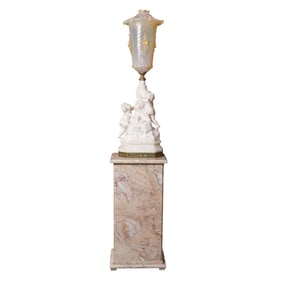 An Italian marble figural table lamp with Venetian glass shade and a marble pedestal