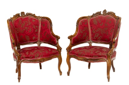 A pair of Louis XV style walnut fauteuils en cabriolet
