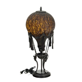 A whimsical bronze and tortoiseshell glass hot air baloon table lamp, possibly Maitland Smith