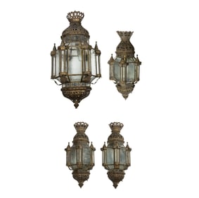 A suite of four Moorish glass and tole lanterns
