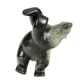 An Inuit carved serpenitne figure of a dancing bear, signed on foot, 8"h