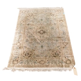 A Persian silk carpet