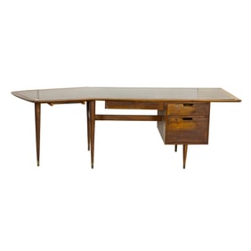 A Mid-Century walnut boomerang desk