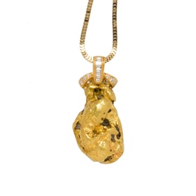 A diamond, gold nugget and 18k gold pendant with 14k gold chain