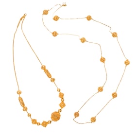 A pair of gold necklaces