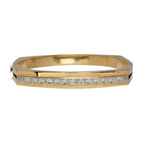 A diamond and 14k gold bangle