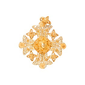 An 18k gold cross pendant