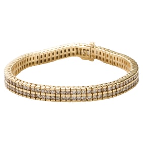 A diamond and 14k gold bracelet