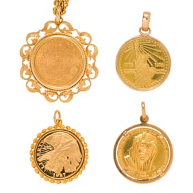 A group of gold coin pendants
