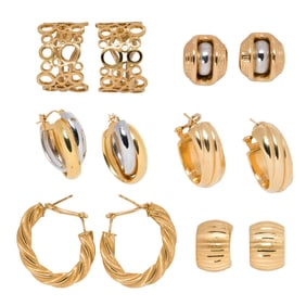 Six pairs of 18k gold earrings