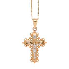 A 14k gold cross pendant necklace
