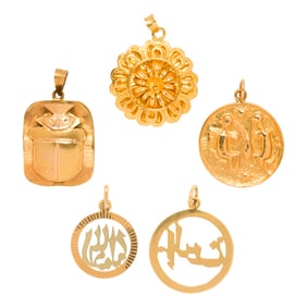 Five gold pendants