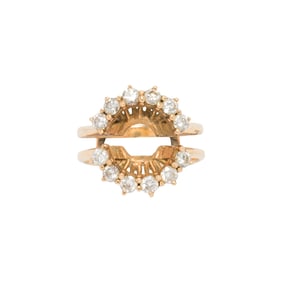 A diamond and 14k gold insert ring