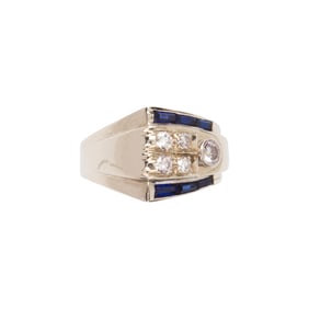 A diamond, synthetic sapphire and 14k white gold ring