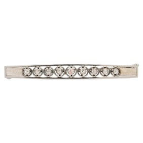 A diamond and 14k white gold brooch