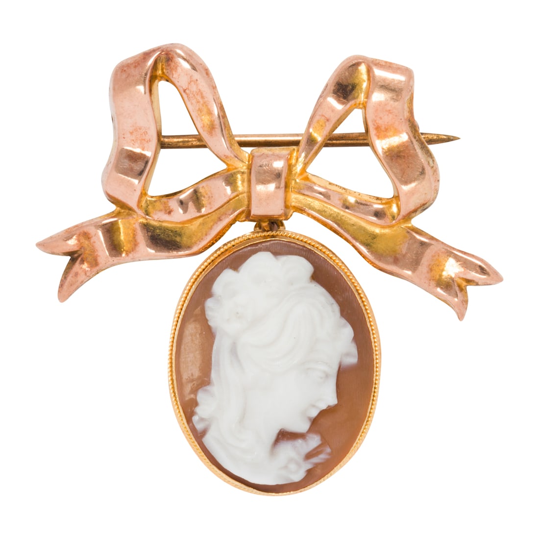 A shell cameo and 9k gold brooch: A shell cameo and 9k gold brooch the shell cameo suspended from a bow motif pin; 3,65 grams; length: 1 1/2 in