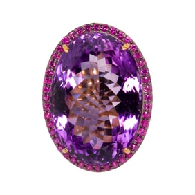 A 14k gold and silver amethyst and sapphire ring