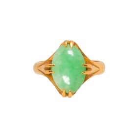 A jade and high karat gold ring