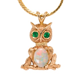 A 14k gold owl pendant and chain