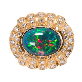 An opal, diamond and 14k gold pendant