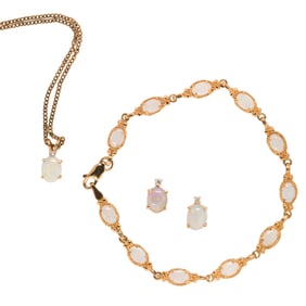 A group of opal, diamond and gold jewelry
