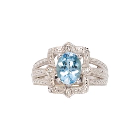 An aquamarine, diamond and 14k white gold ring