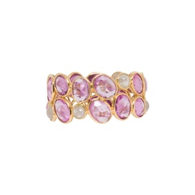 A pink sapphire, diamond and 18k gold ring