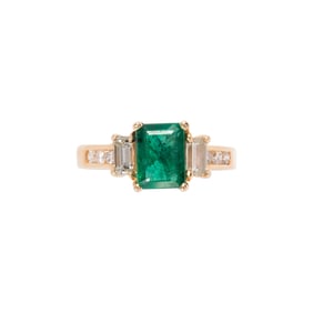 An emerald, diamond and 14k gold ring