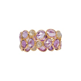 A pink sapphire, diamond, and 18k gold ring