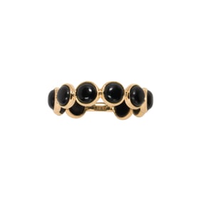 An onyx and 18K gold ring