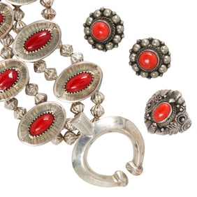 A group of coral and silver jewelry