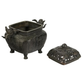 A Chinese bronze lidded incense burner