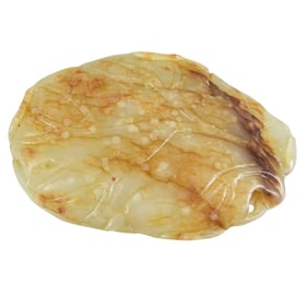 A Chinese russet and white jade toggle