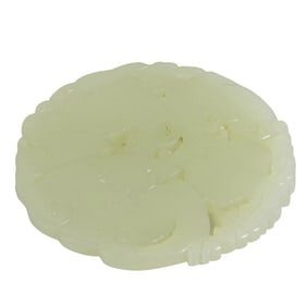 A Chinese white jade circular pendant