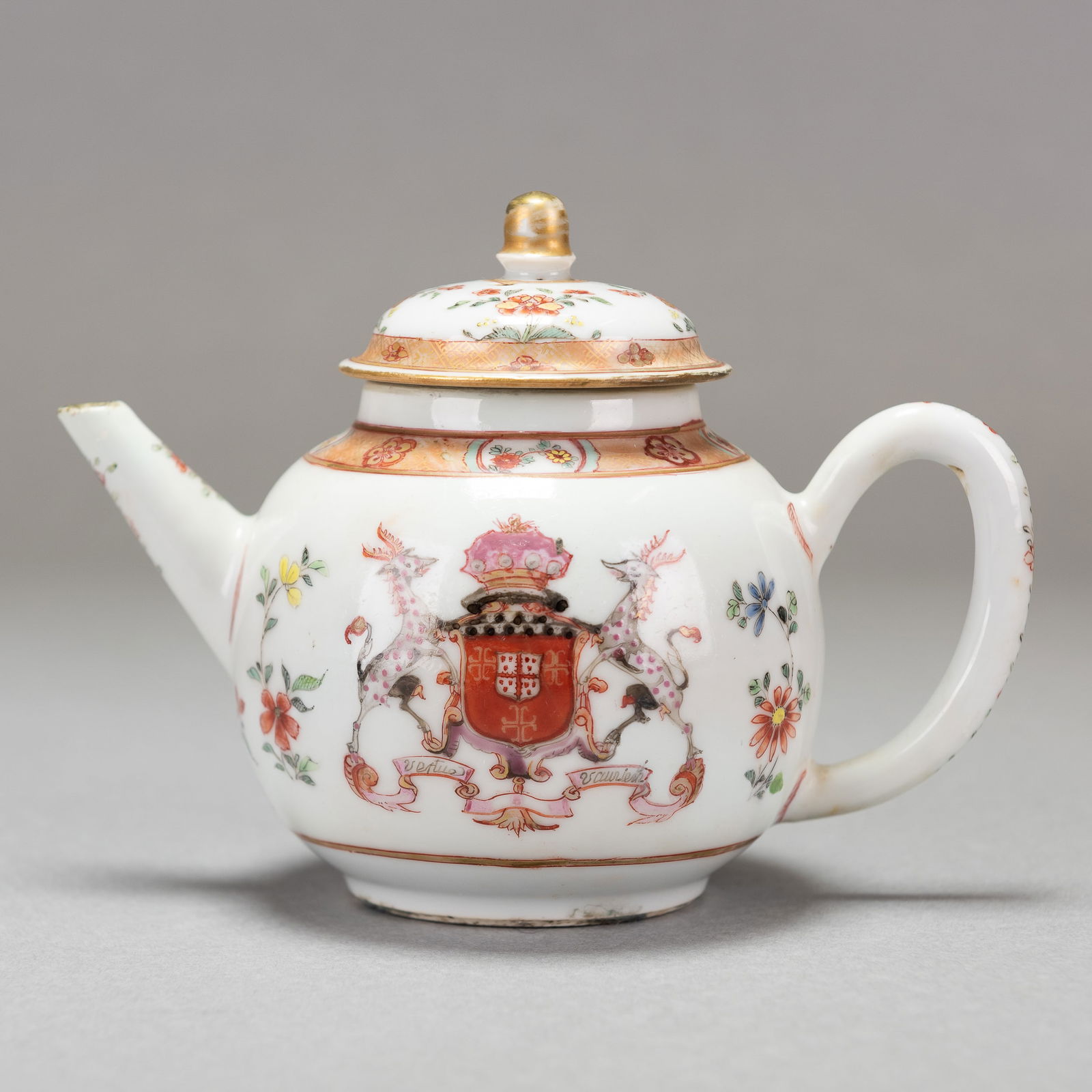 Chinese Export Porcelain Armorial Teapot, Verney and Heath, 18th Century: Chinese export porcelain armorial teapot, verney and heath, 18th century. With a coat of arms Verney with Heath in pretense, a banner reading "Vertue Vaunceth", rouge de fer and gold decoration, lid i