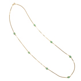 A 14k gold and jade necklace