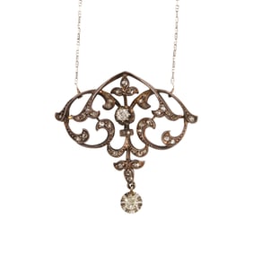 A diamond, silver and gold necklace