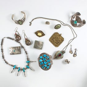 A bag of silver and hardstone jewelry