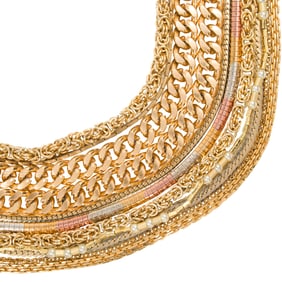 A large assortment of gold costume chains