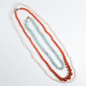 A group of hardstone and pearl necklaces