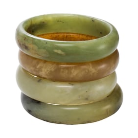 Four jade and hardstone bangles
