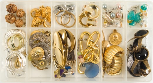 A box of costume jewelry earrings