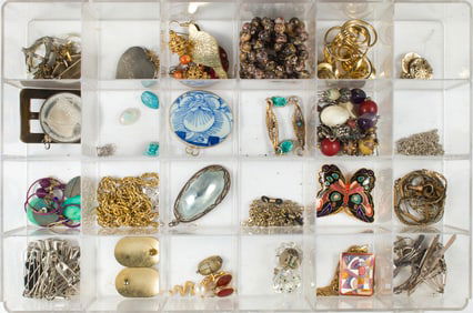 A box of enamel, silver, hardstone and base metal jewelry