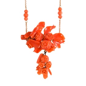 A coral and 14k gold brooch