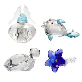 A group of four aquatic Swarovski crystals