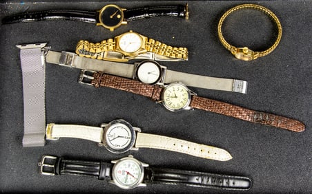 A lot of seven wristwatches including: Coach, Movado, Seiko